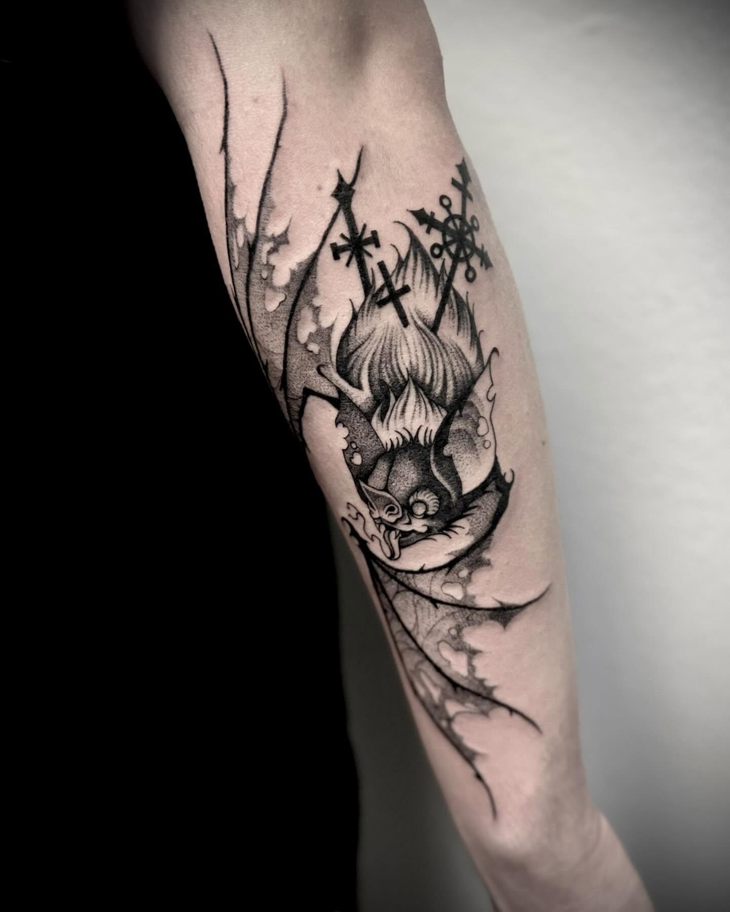Flame and crosses dotwork tattoo on the forearm by Melanie