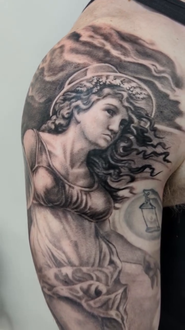 A classical female figure realism tattoo by Sean Costello