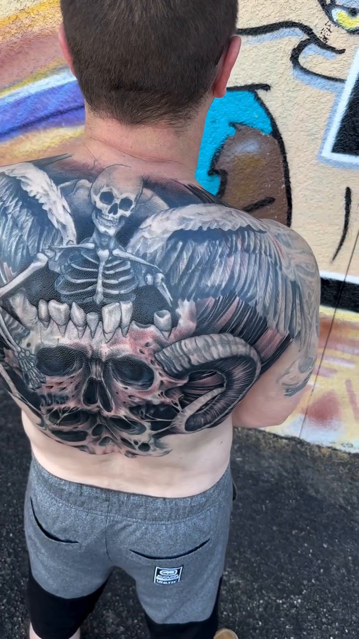 Tattoo by @inkplug__higherlevel — dark_realism, black_and_grey