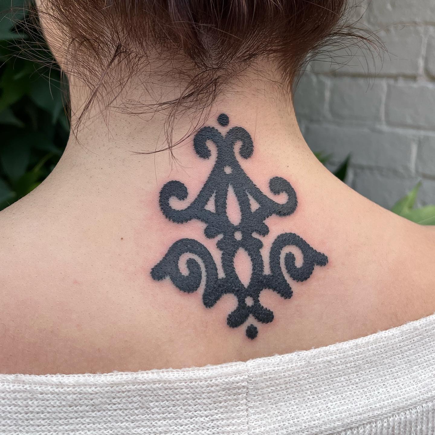 Scrollwork black and grey tattoo on the neck by kevvy
