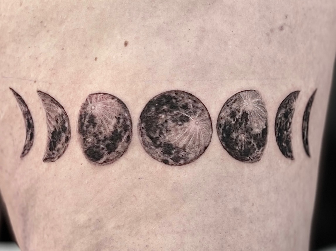 Moon phases black and grey tattoo on the forearm by Tattoos by Marcy