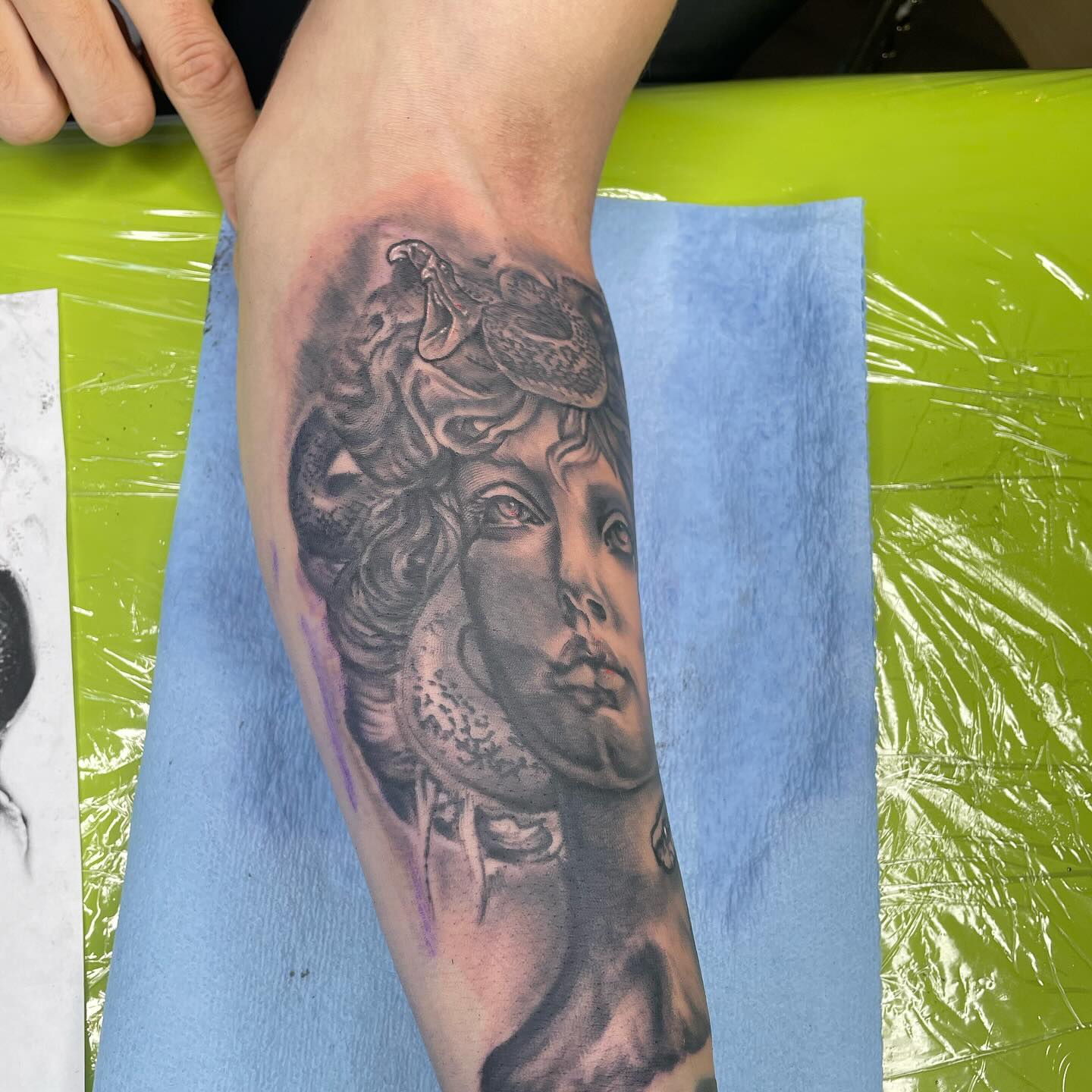 Medusa portrait realism tattoo on the forearm by Aaron Ysidro