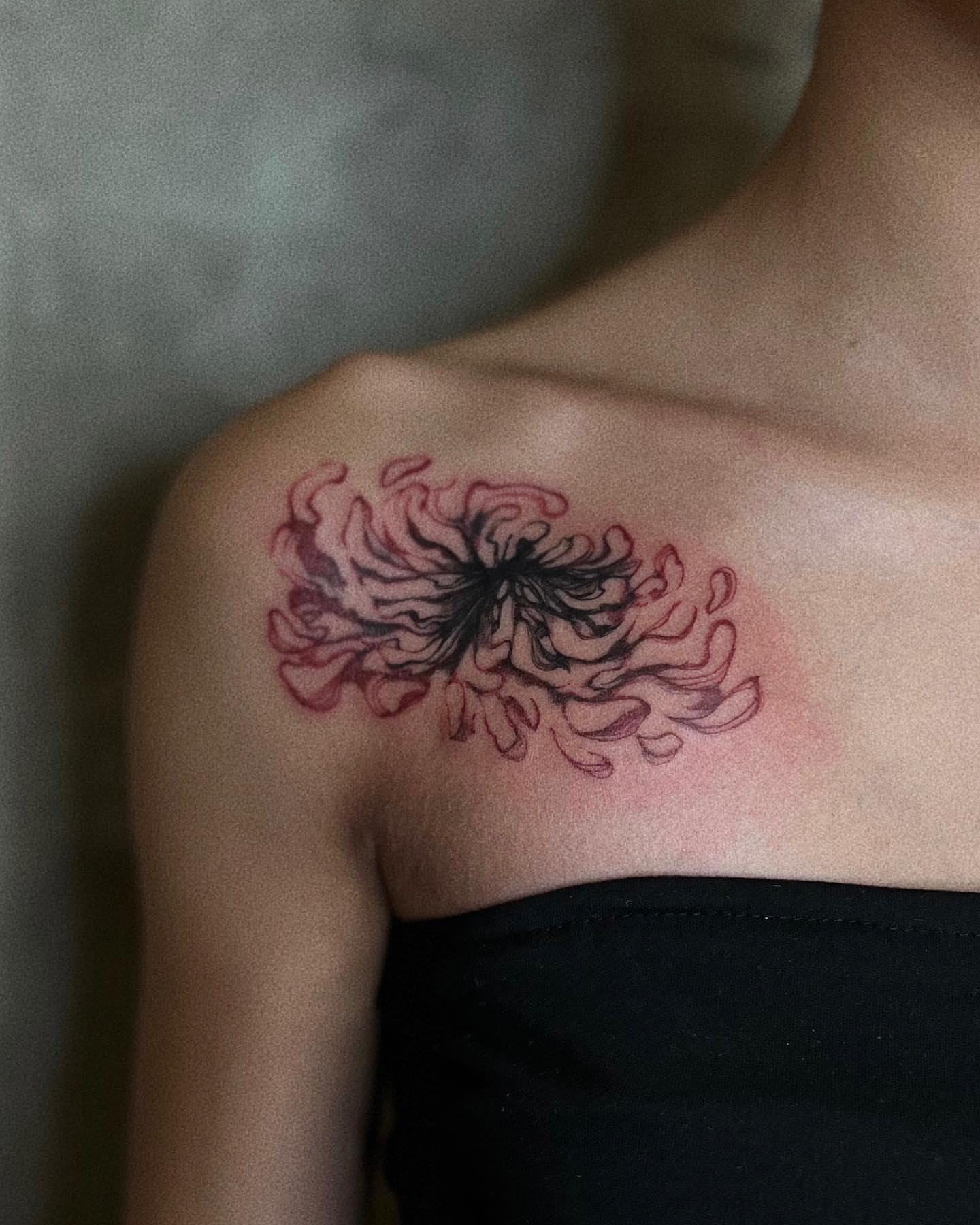 Chrysanthemum dotwork tattoo on the shoulder by San Kang