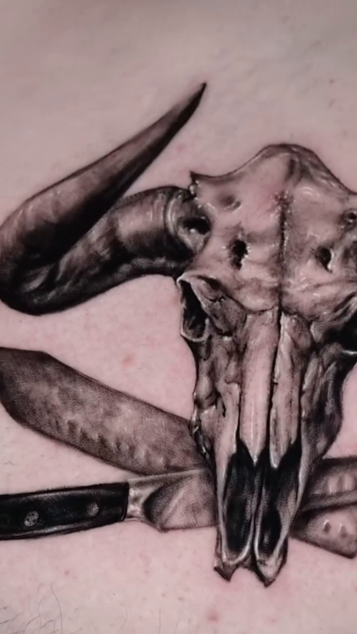 Bull skull with knives realism tattoo by Gregorio Devera