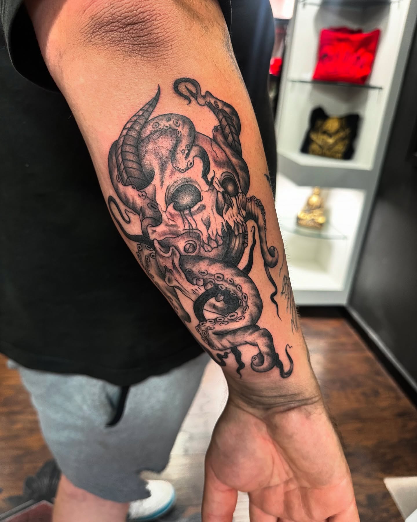 Skull with tentacles dark realism tattoo on the forearm by Kassie Perian
