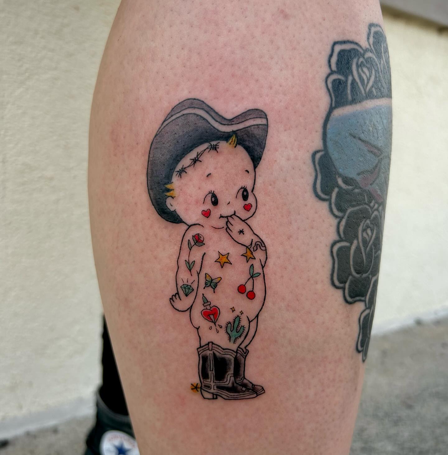 Baby with cowboy hat American traditional tattoo on the forearm by 𝕯𝖆𝖓𝖎