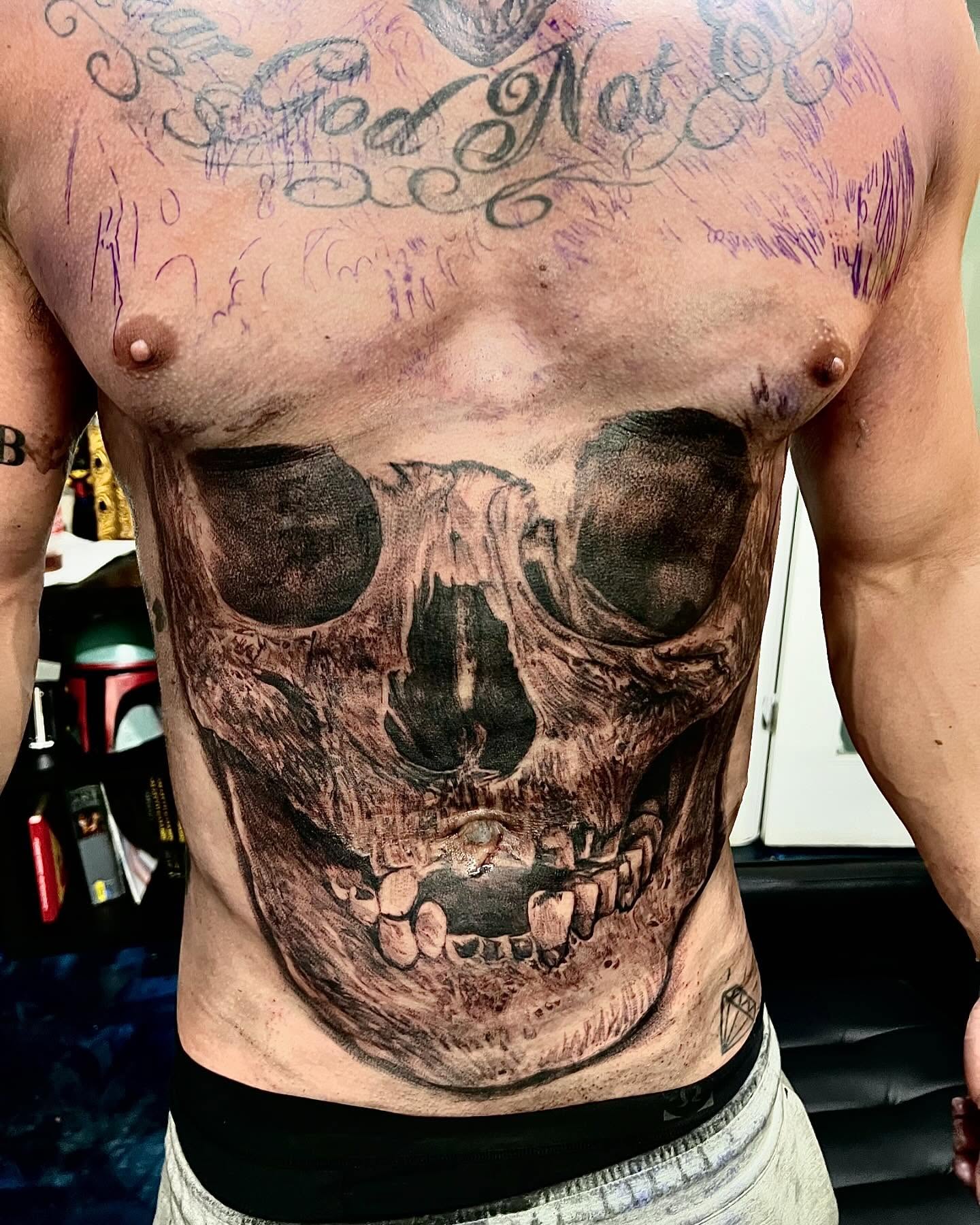 Skull realism tattoo on the chest by Creeper tattoo