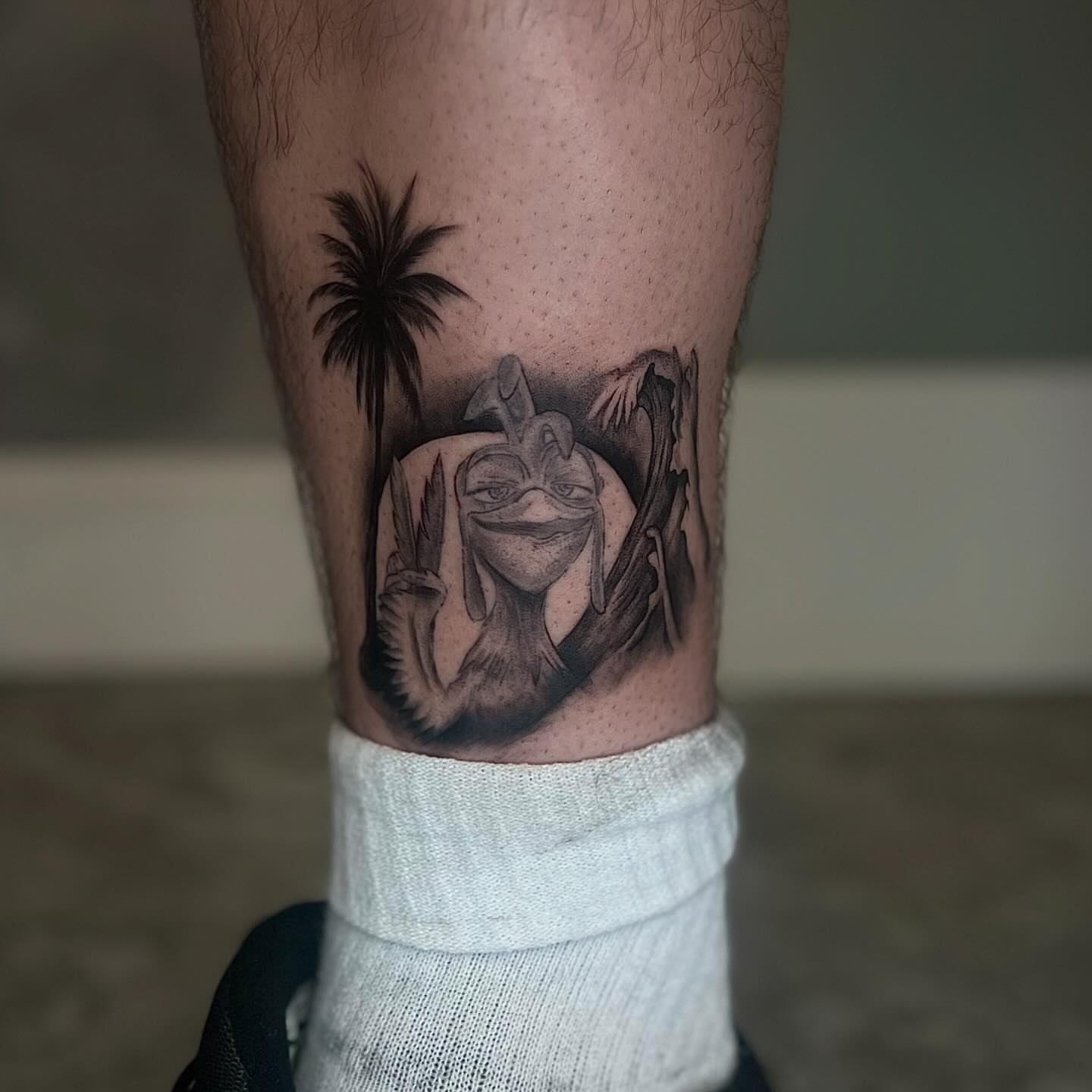 Baby yoda black and grey tattoo on the calf by Jocelyn
