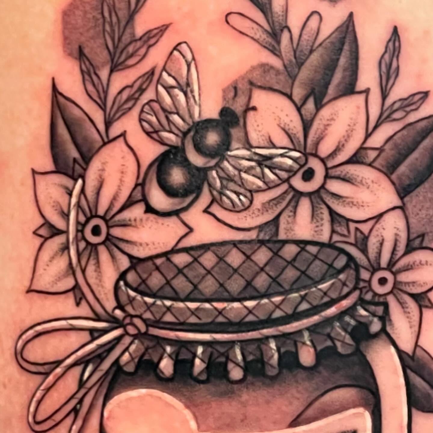 Bee and flowers American traditional tattoo on the forearm by Candence Smith