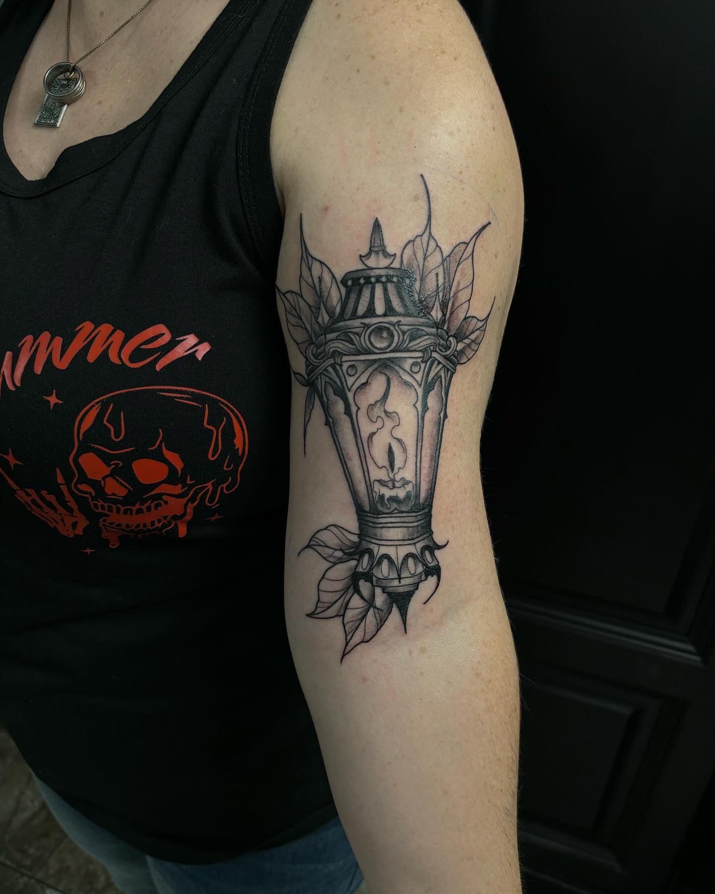 Lantern black and grey tattoo on the forearm by Ares Rhodes
