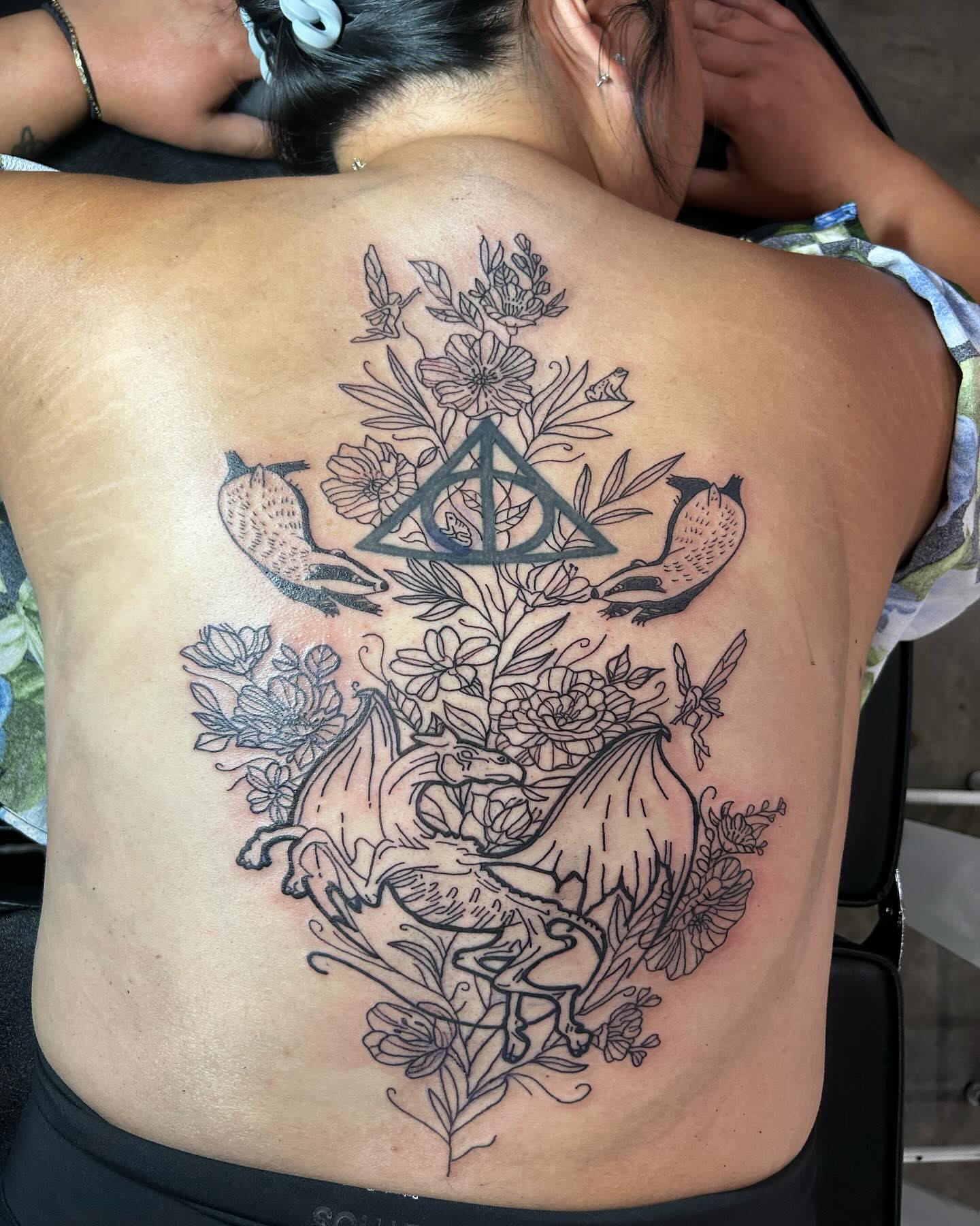 Flowers and birds geometric tattoo on the back by goose 🪿