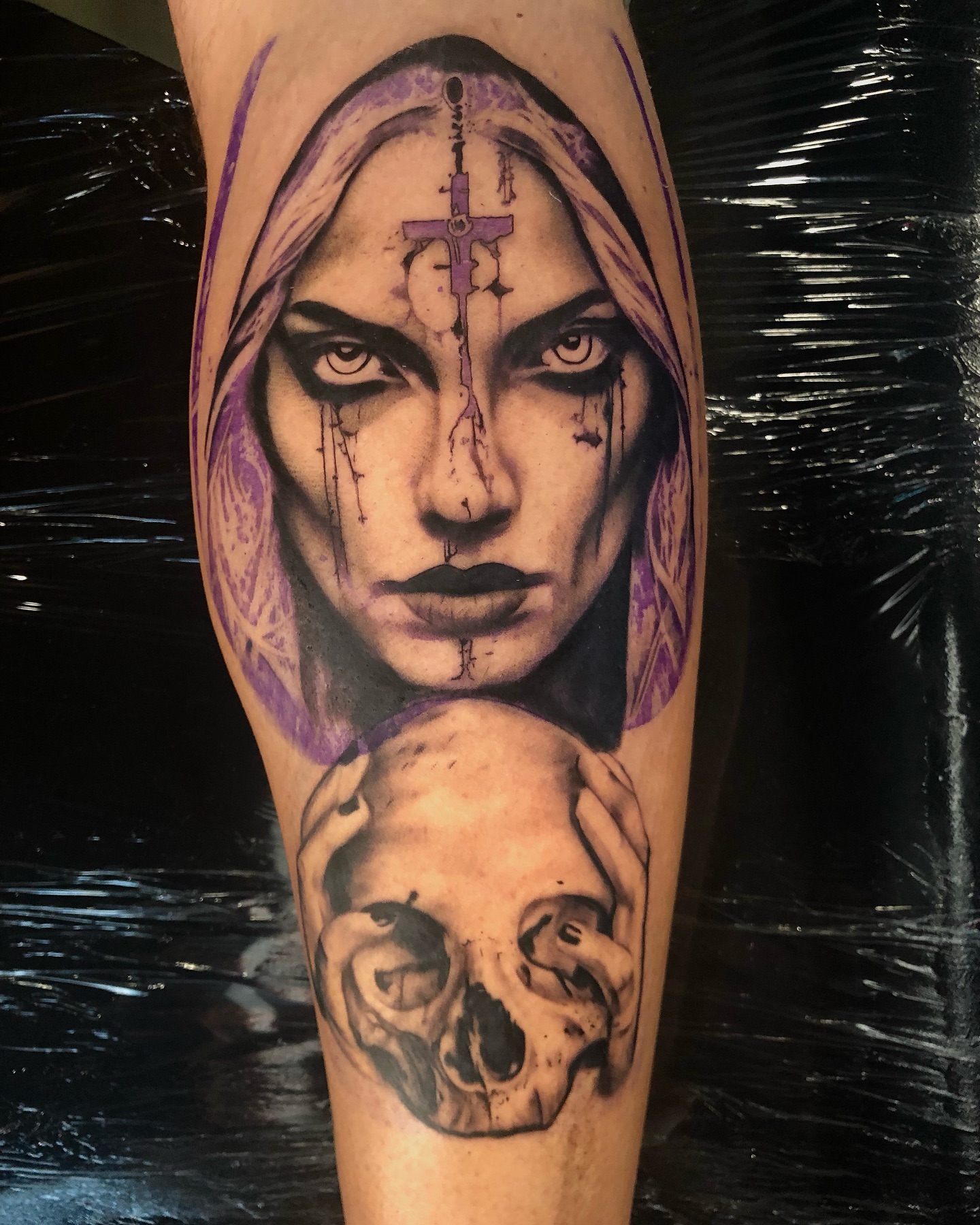 Woman with skull dark realism tattoo on the forearm by Ian Chancellor, Leighton Buzzard, England