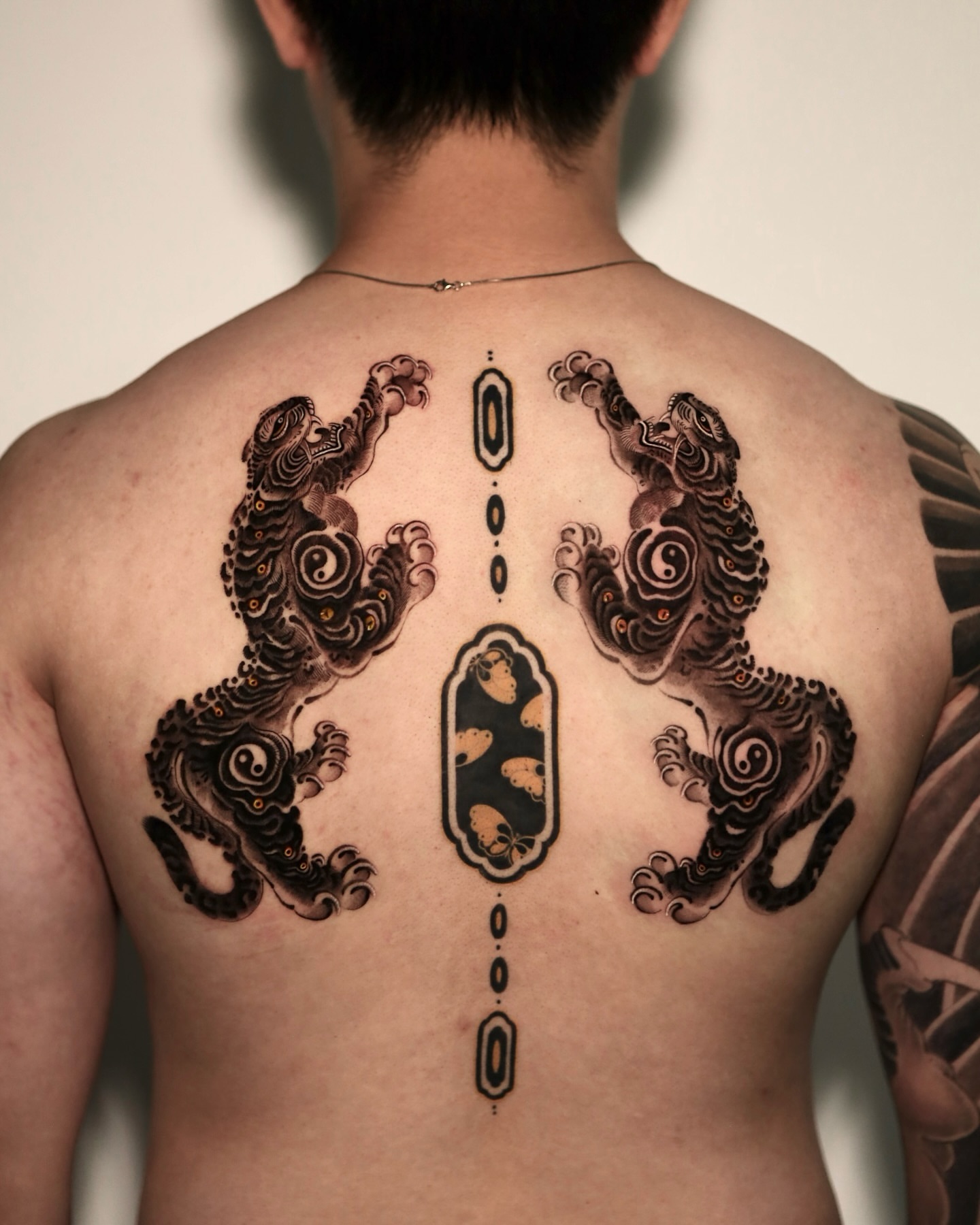Two leaping lions japanese irezumi tattoo on the back by 𝐆𝐑𝐄𝐄𝐃