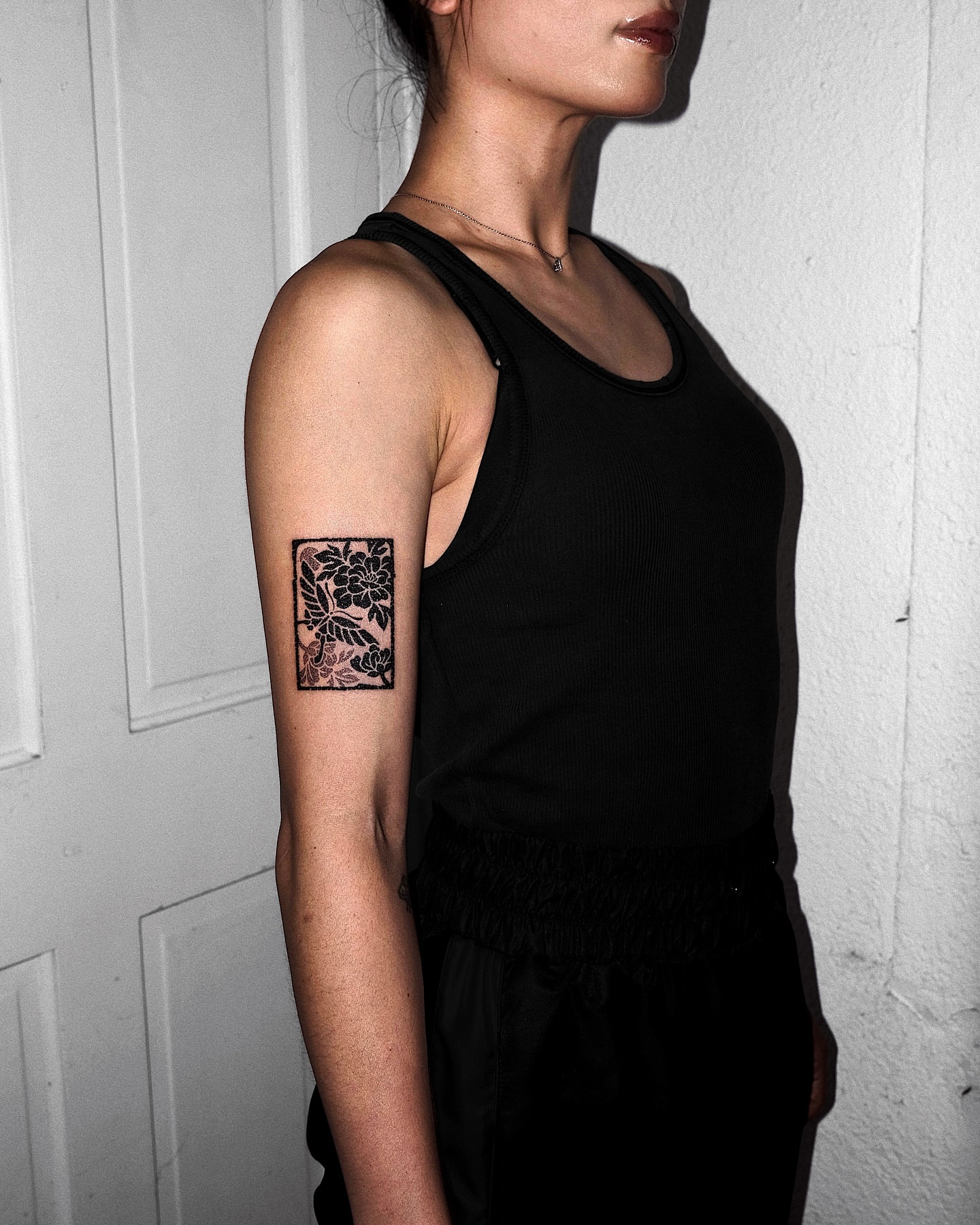 Floral black and grey tattoo on the forearm by Mooro