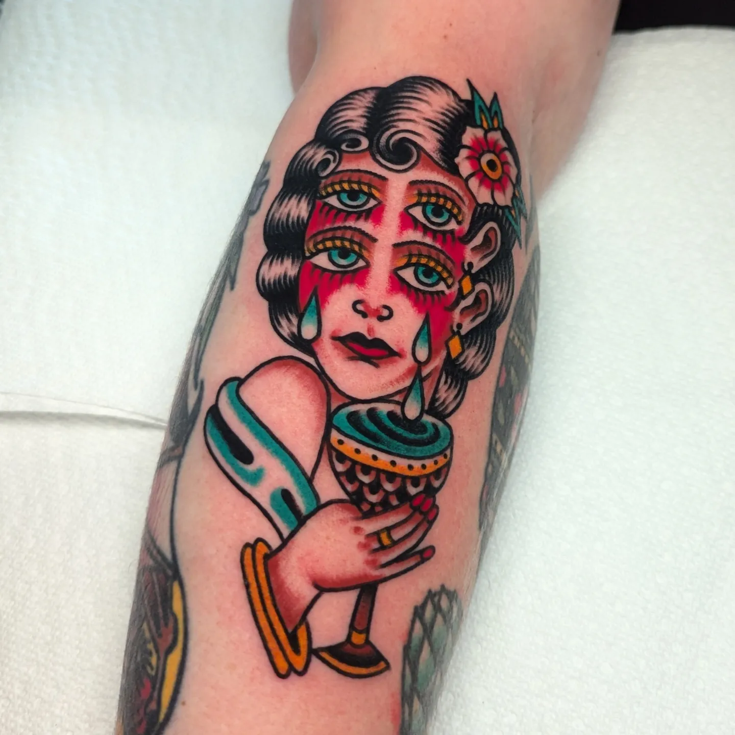 Woman with tambourine American traditional tattoo on the forearm by Zack Mueller