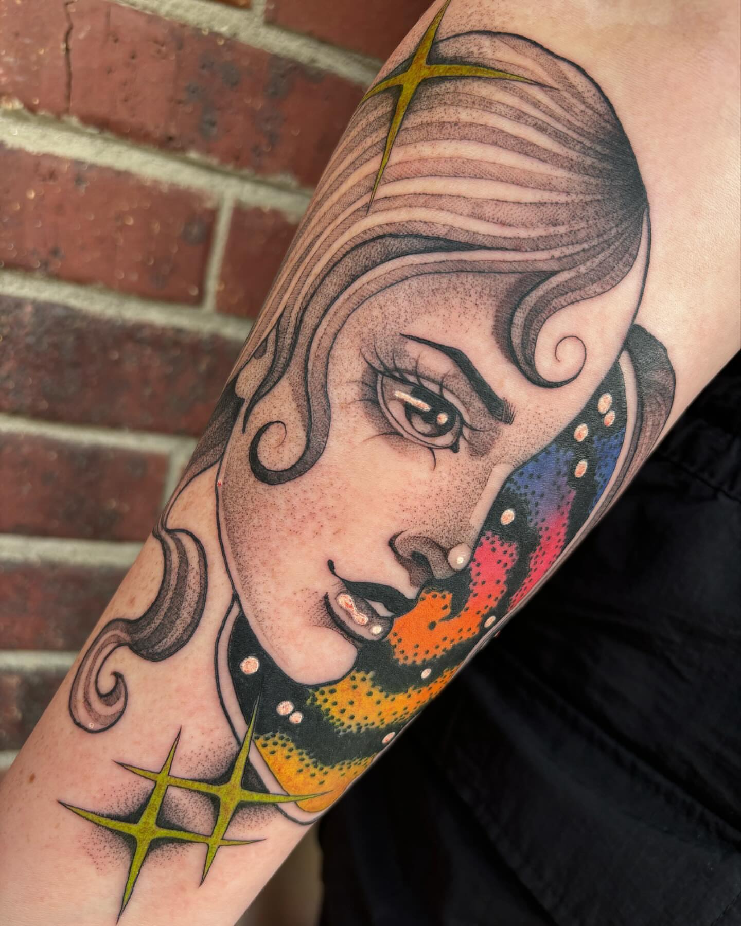 Woman's face American traditional tattoo on the forearm by Carly Zehring