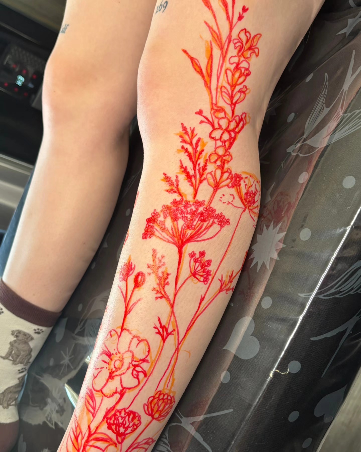 Floral arrangement watercolor tattoo on the forearm by Utah Tattoo Artist