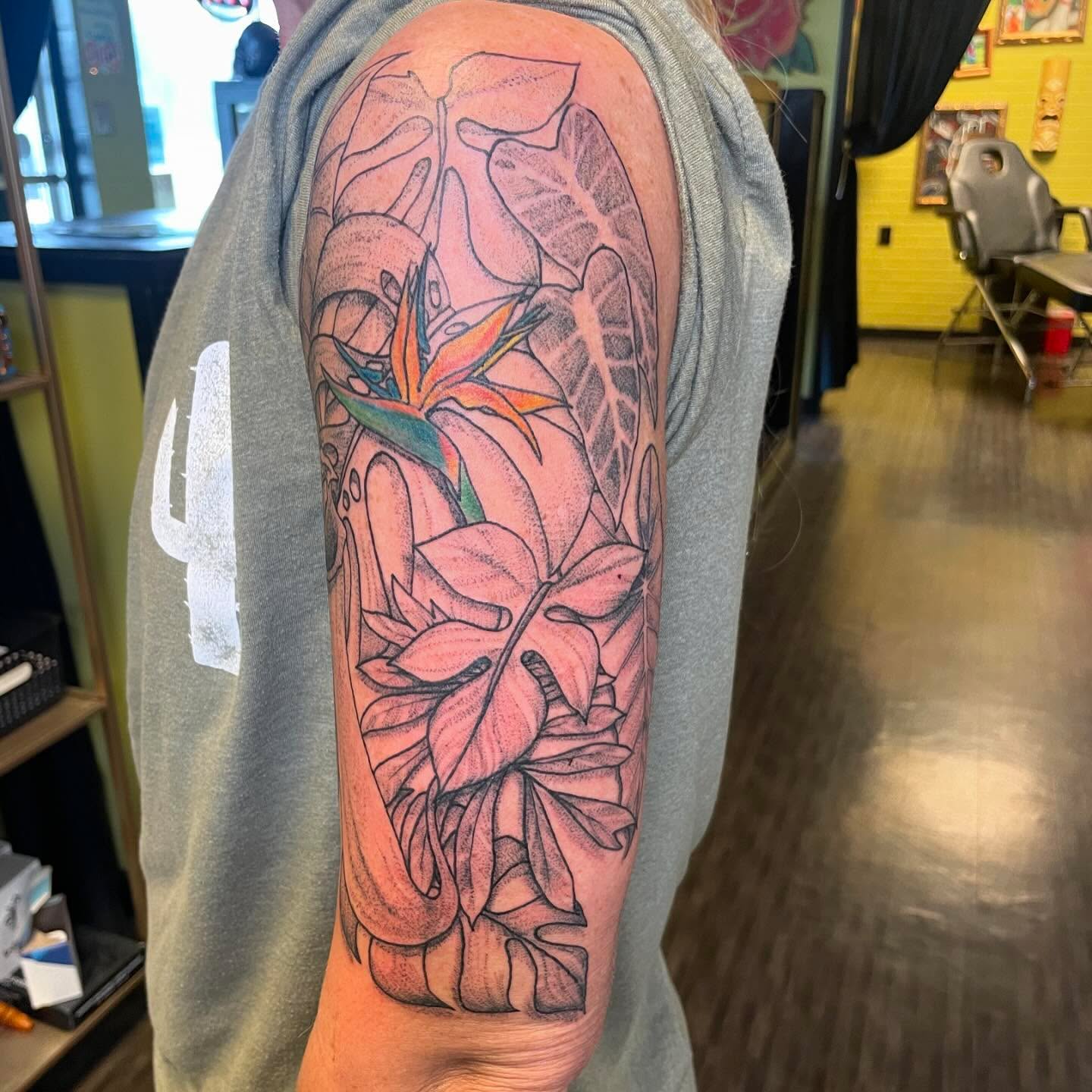 Bird of paradise and leaves dotwork tattoo on the forearm by Evan