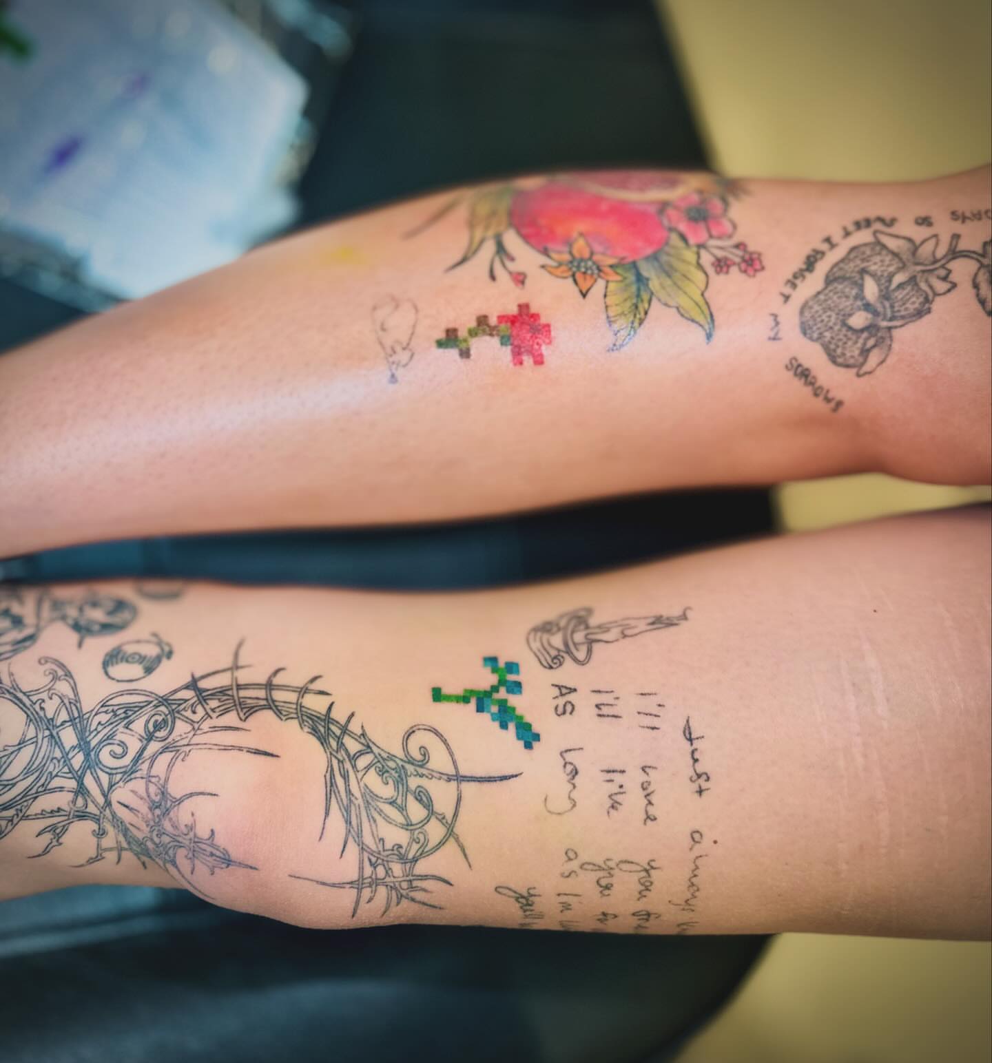 Pixelated cross dotwork tattoo on the thigh by Jewels, St. George, Utah