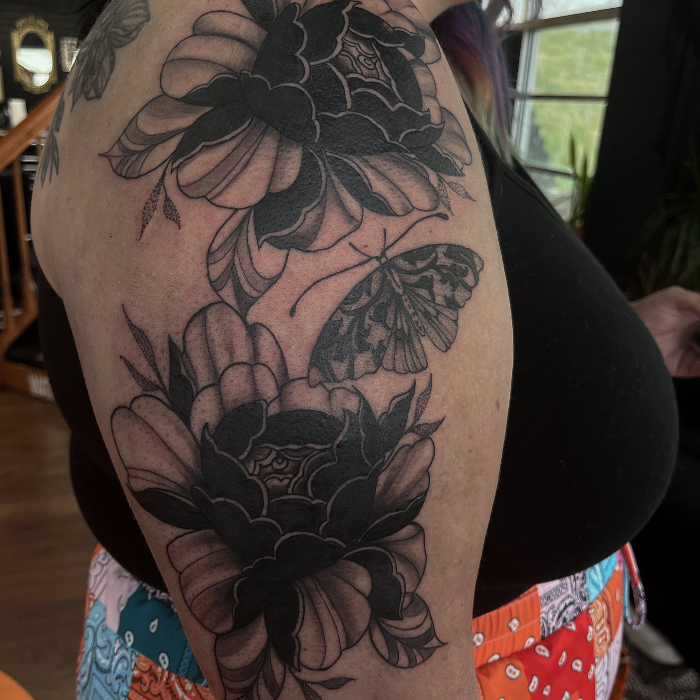 Flowers and butterfly black and grey tattoo on the shoulder by ⚜️Embodied Tattoo⚜️, Columbus, Ohio