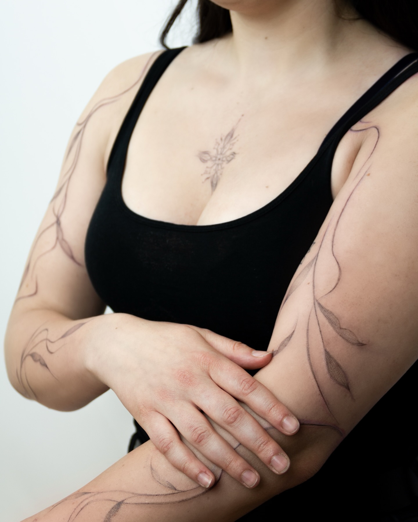 Floral vine black and grey tattoo on the chest by Liv