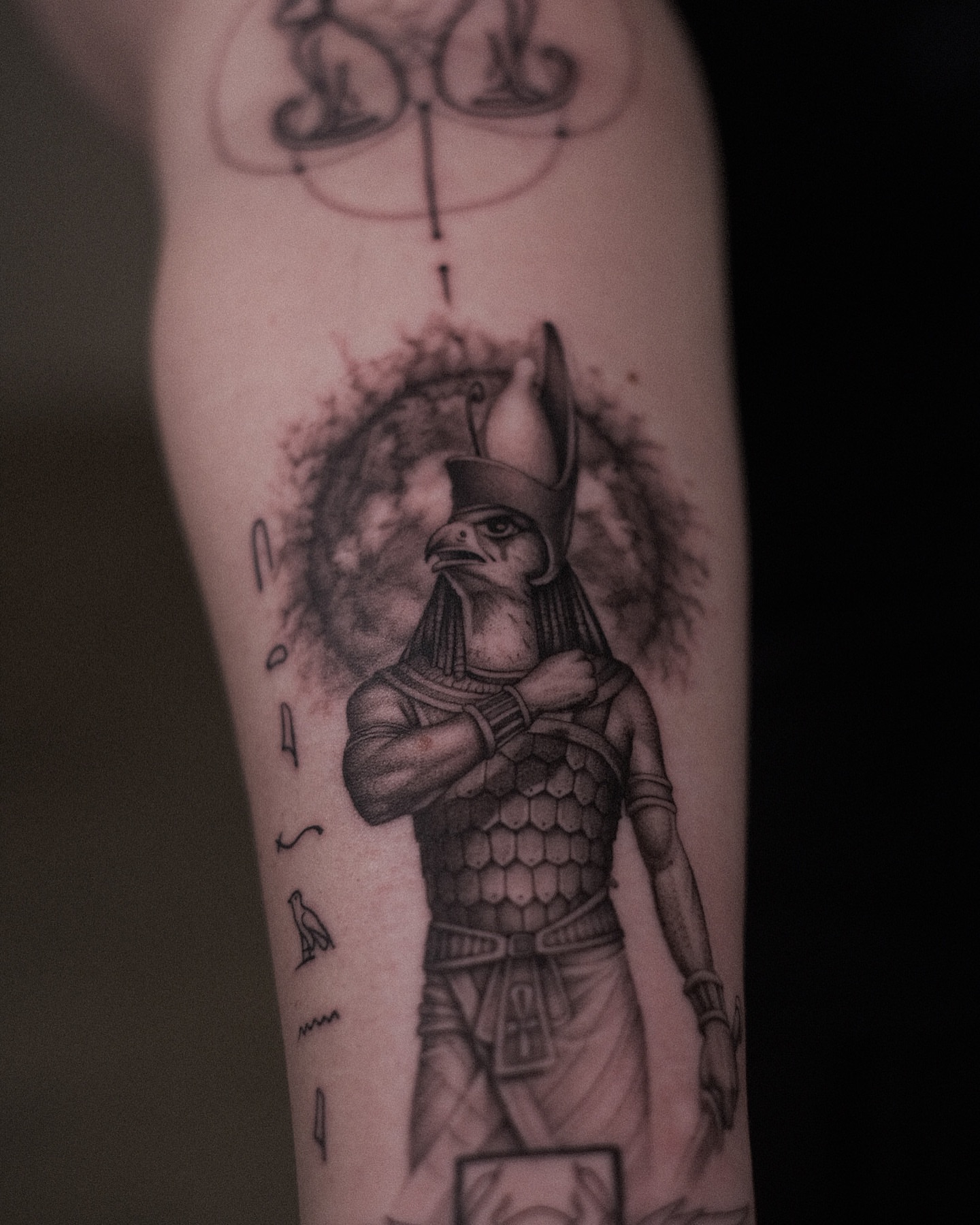 Egyptian god black and grey tattoo on the forearm by Oleksandr Moroz