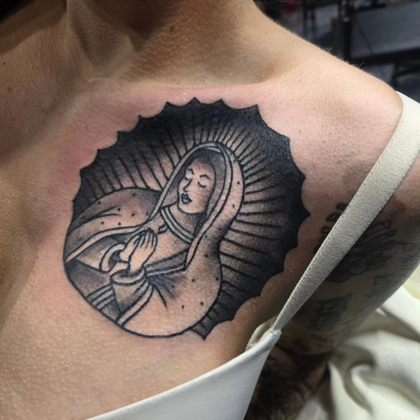 Virgin mary black and grey tattoo on the chest by David Johnson