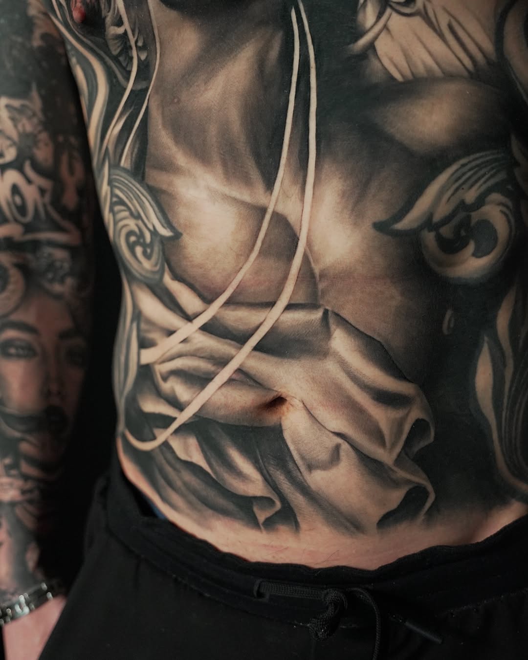 Tattoo by @heavyhitterbam — realism, black_and_grey