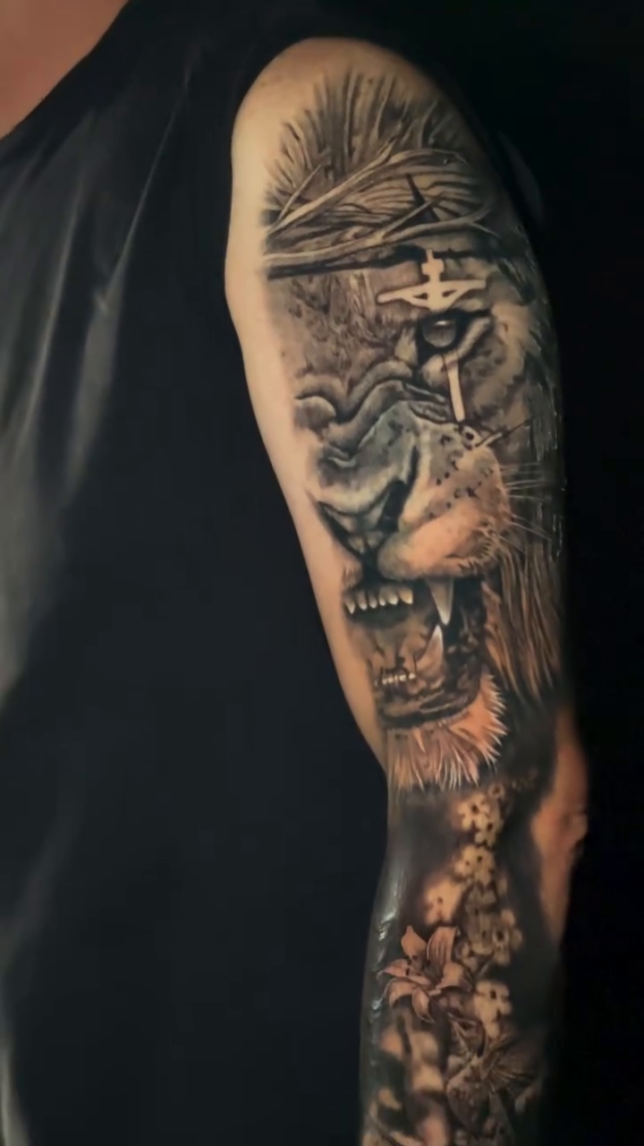 Lion with crown and cross realism tattoo by Ian Vanderwerff