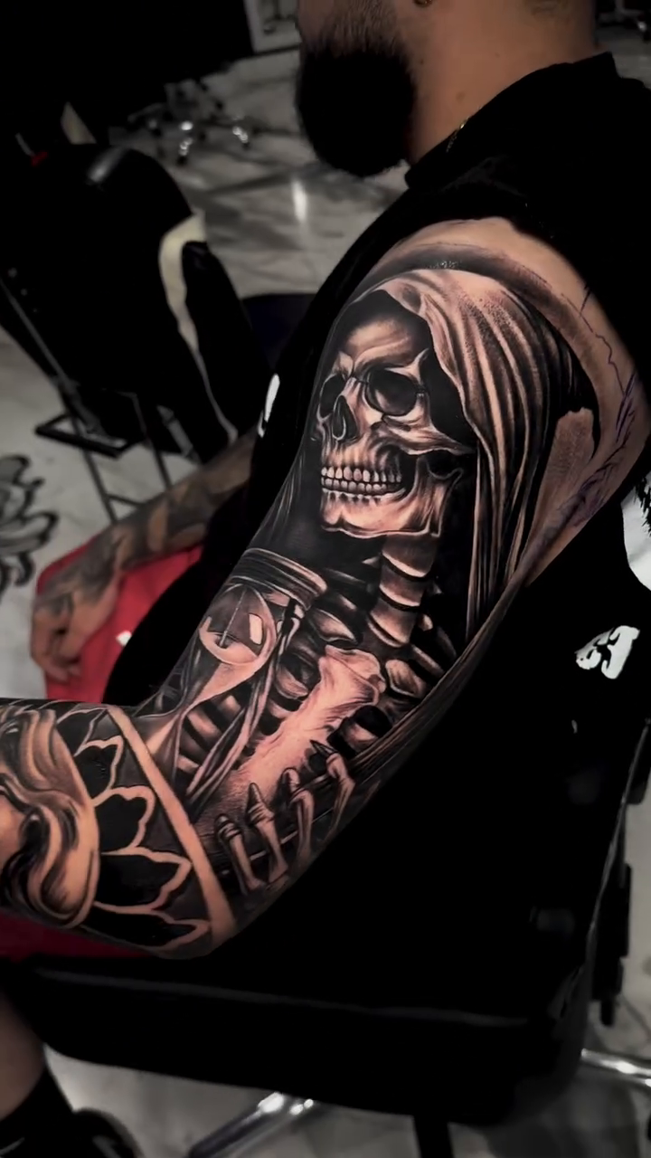 Grim reaper and woman dark realism tattoo by Tattoo
