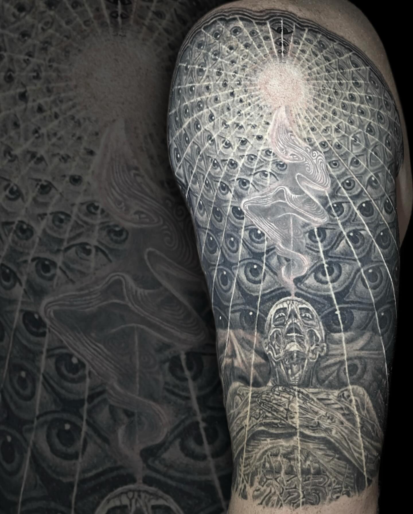 Abstract surrealism surrealism tattoo on the forearm by Mike Shultz