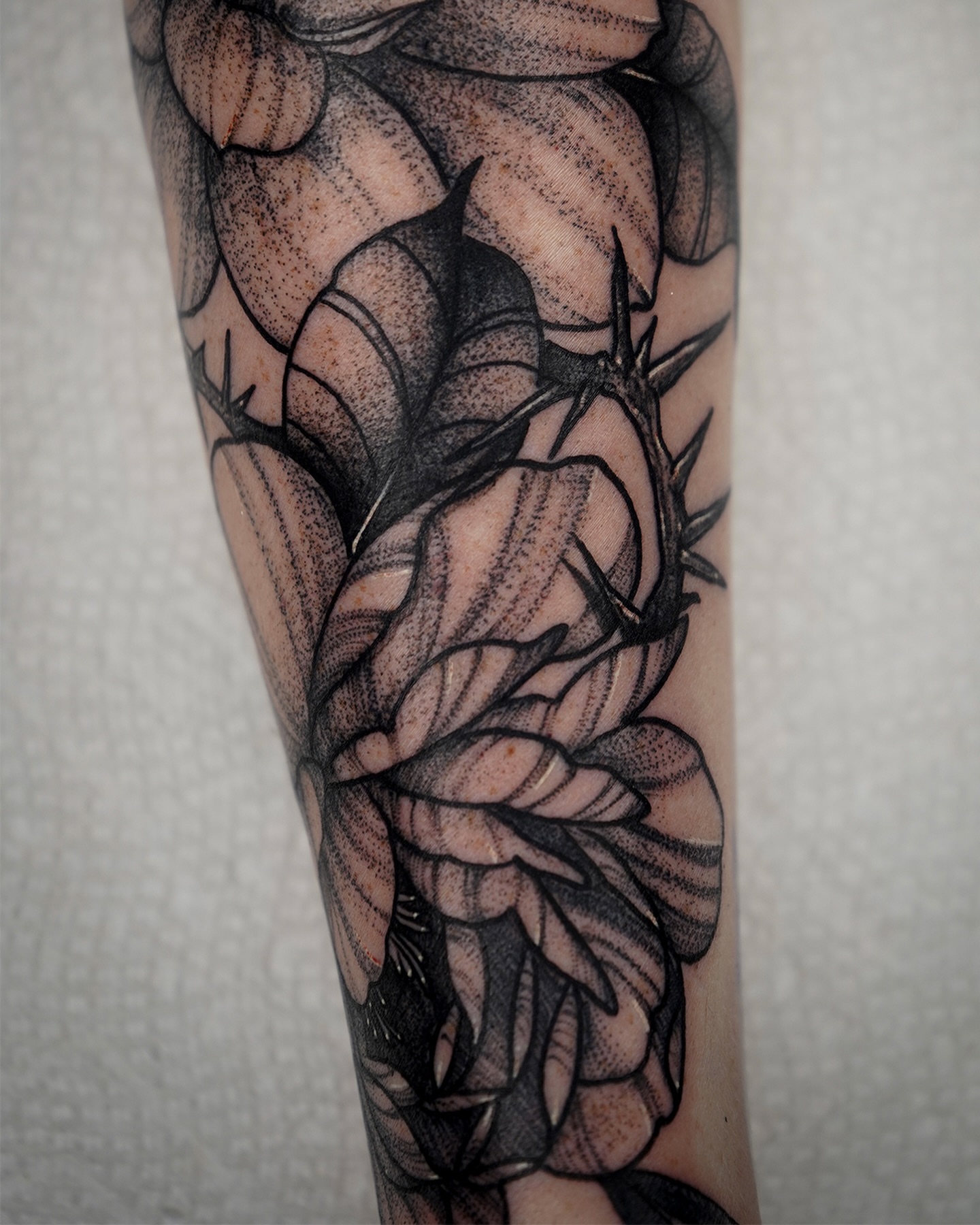 Thorn crown dotwork tattoo on the forearm by Tony Murray