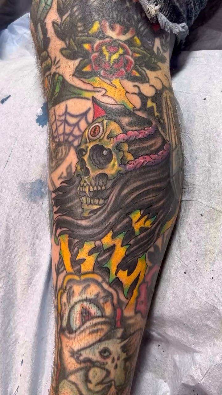 Skull with lightning and flowers dark realism tattoo by Dustin Hysell