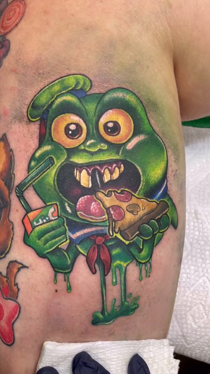 Slimer eating pizza new school tattoo by Alexandra Fische
