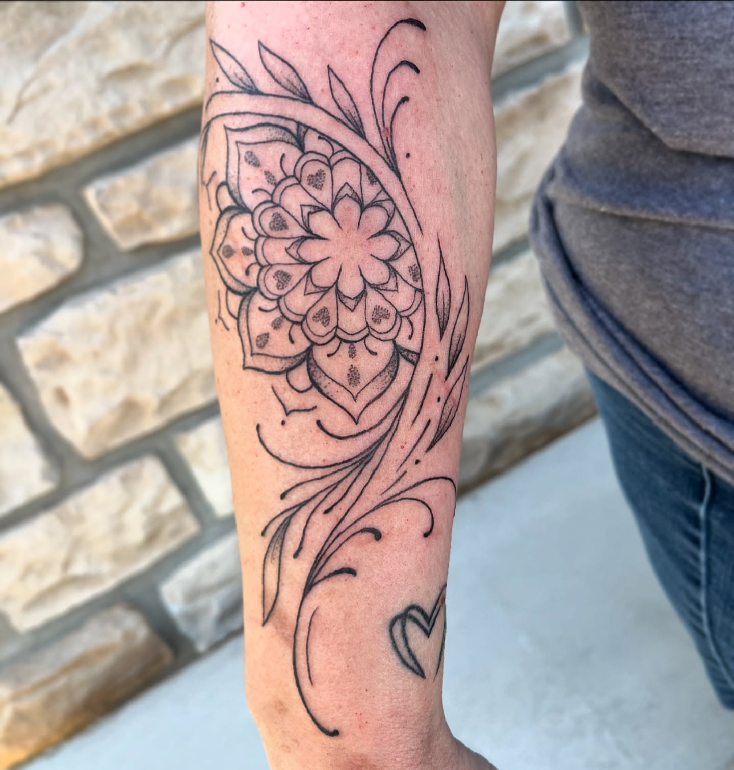 Floral mandala black and grey tattoo on the forearm by Tina Petrullo, West Chester Township, Butler County, Ohio