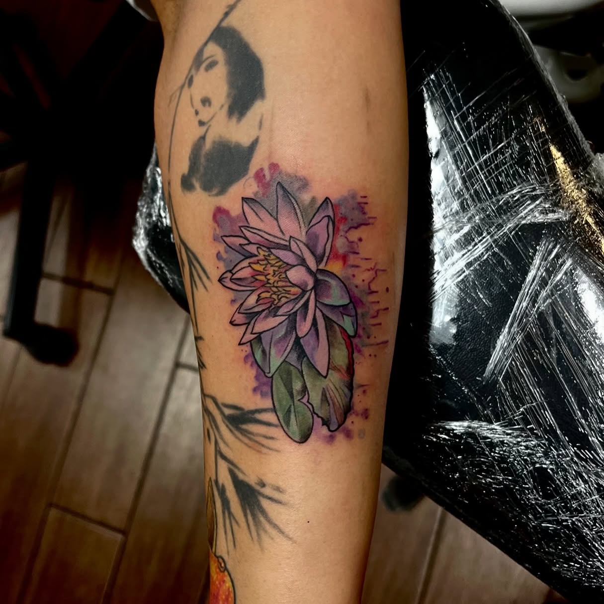 Water lily watercolor tattoo on the forearm by Houston Tattoo Artist