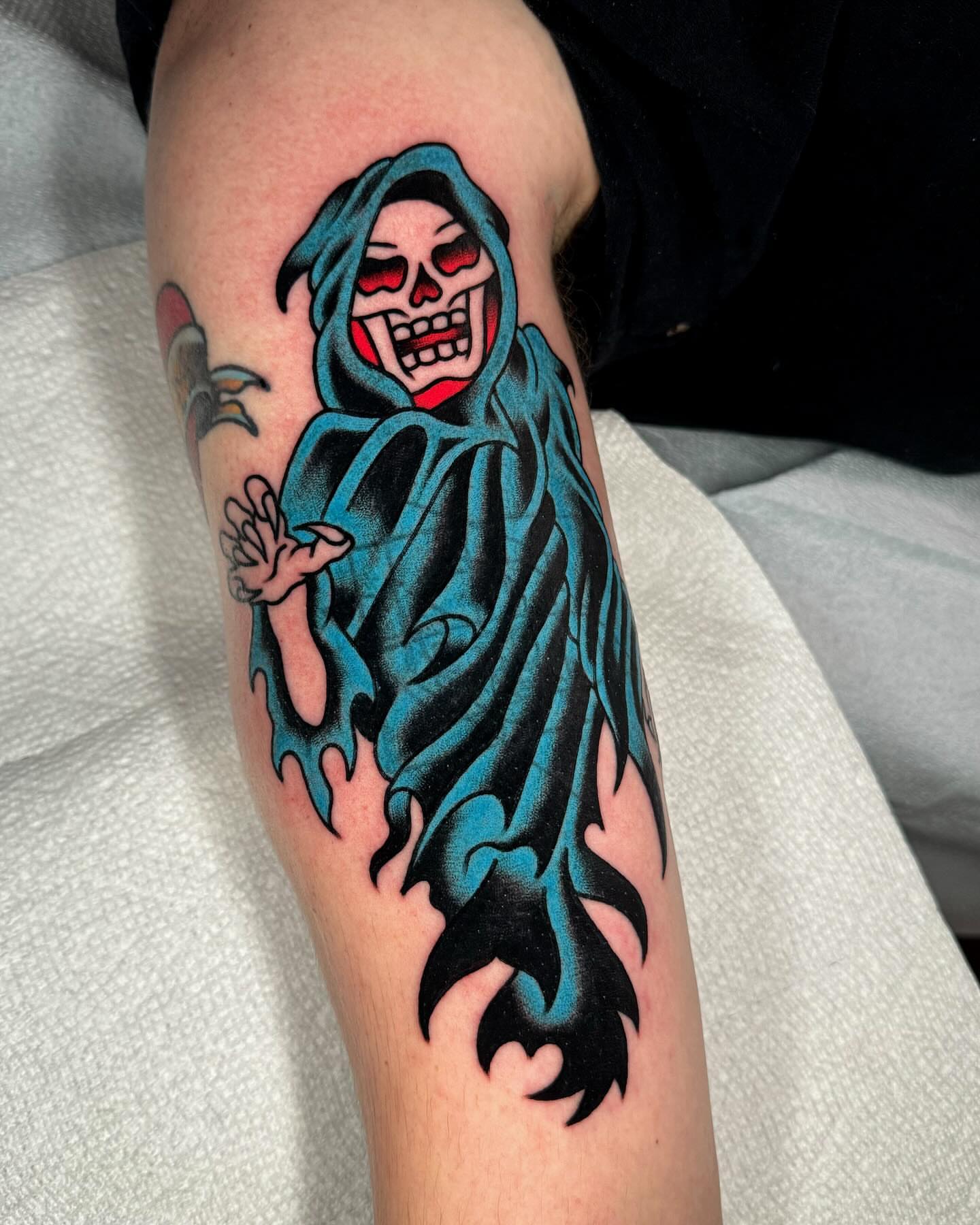 Grim reaper American traditional tattoo on the forearm by James Shepherd, Austin, Texas