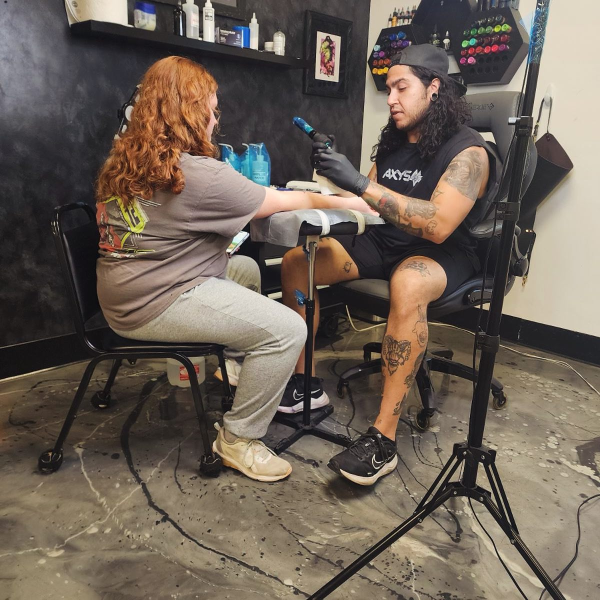Tattoo artist and client American traditional tattoo on the upper arm by Brandon Anderson