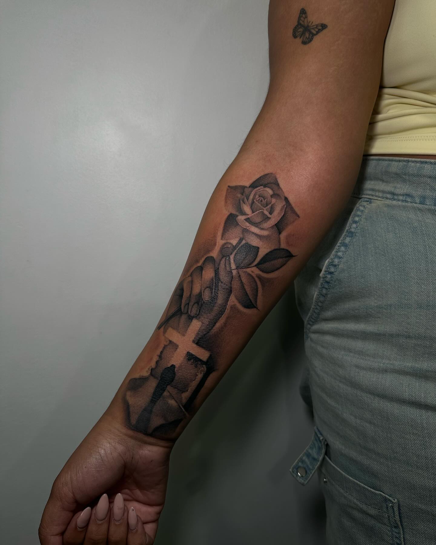 Cross and rose realism tattoo on the forearm by @piinkywabbiit, Roselle Park, New Jersey