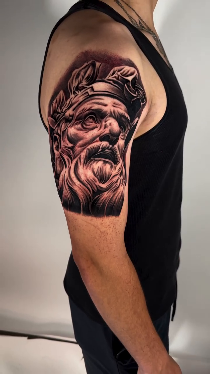 Greek god portrait realism tattoo by Andrew Wine🍷Tattoo
