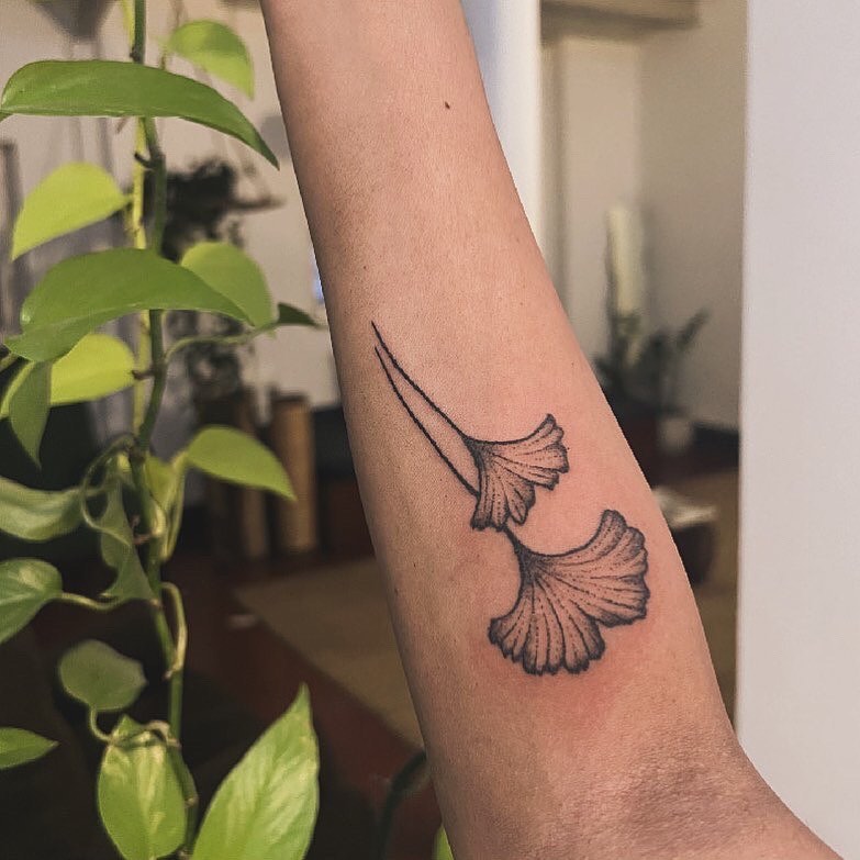 Gingko leaves black and grey tattoo on the forearm by Gaya
