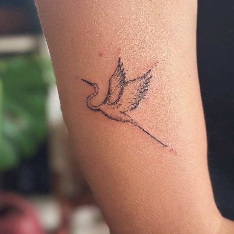 Bird minimalist tattoo on the forearm by Gaya