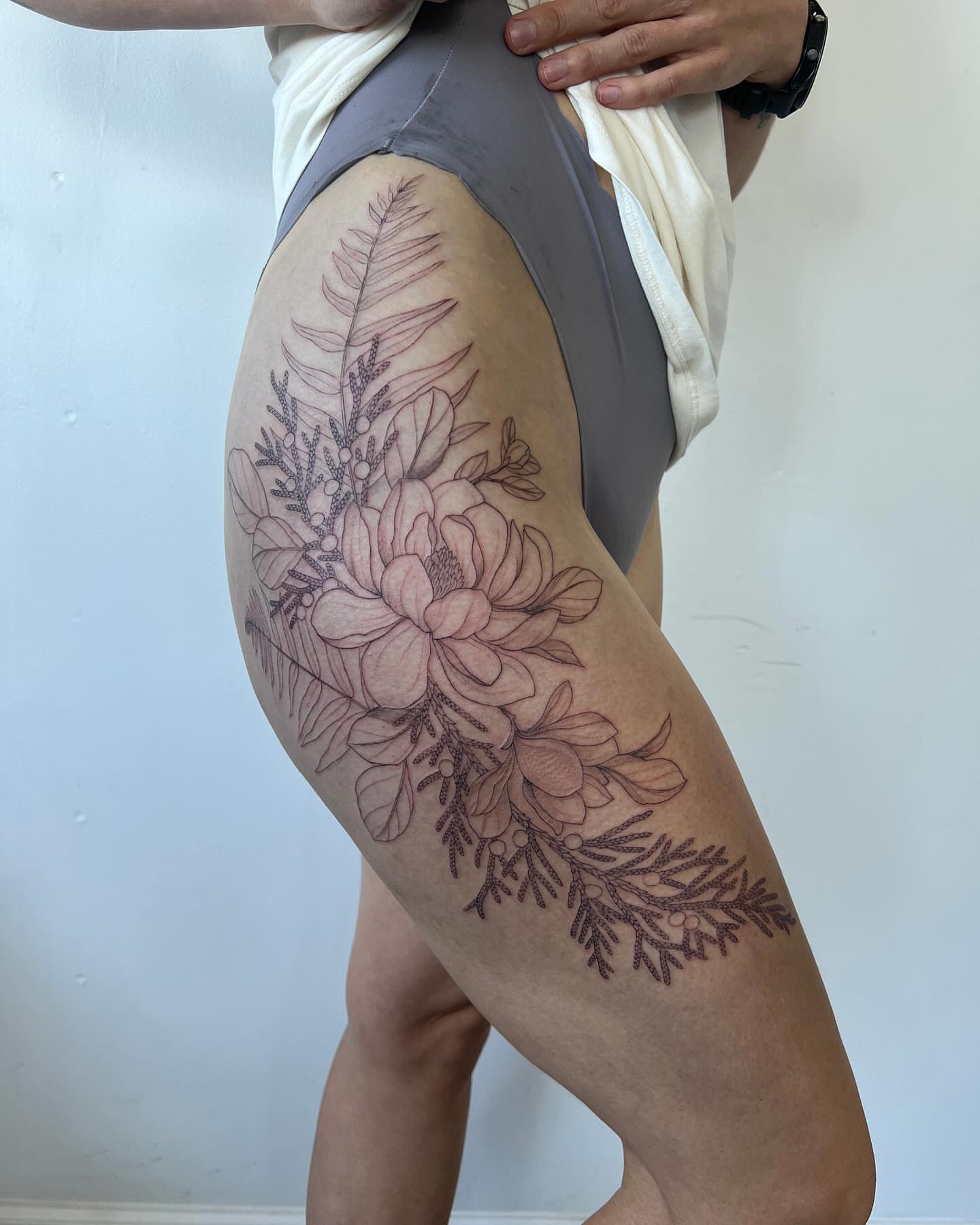 Floral arrangement black and grey tattoo on the thigh by See See : botanical tattoo artist :