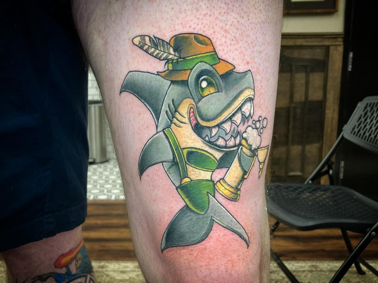 Shark American traditional tattoo on the thigh by Bobby Trefz