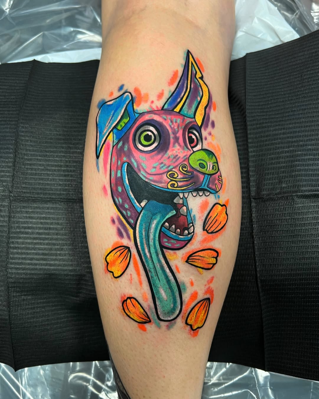 Dog with tongue out ignorant tattoo on the forearm by Hugh Anthony Washington, Hattiesburg, Mississippi