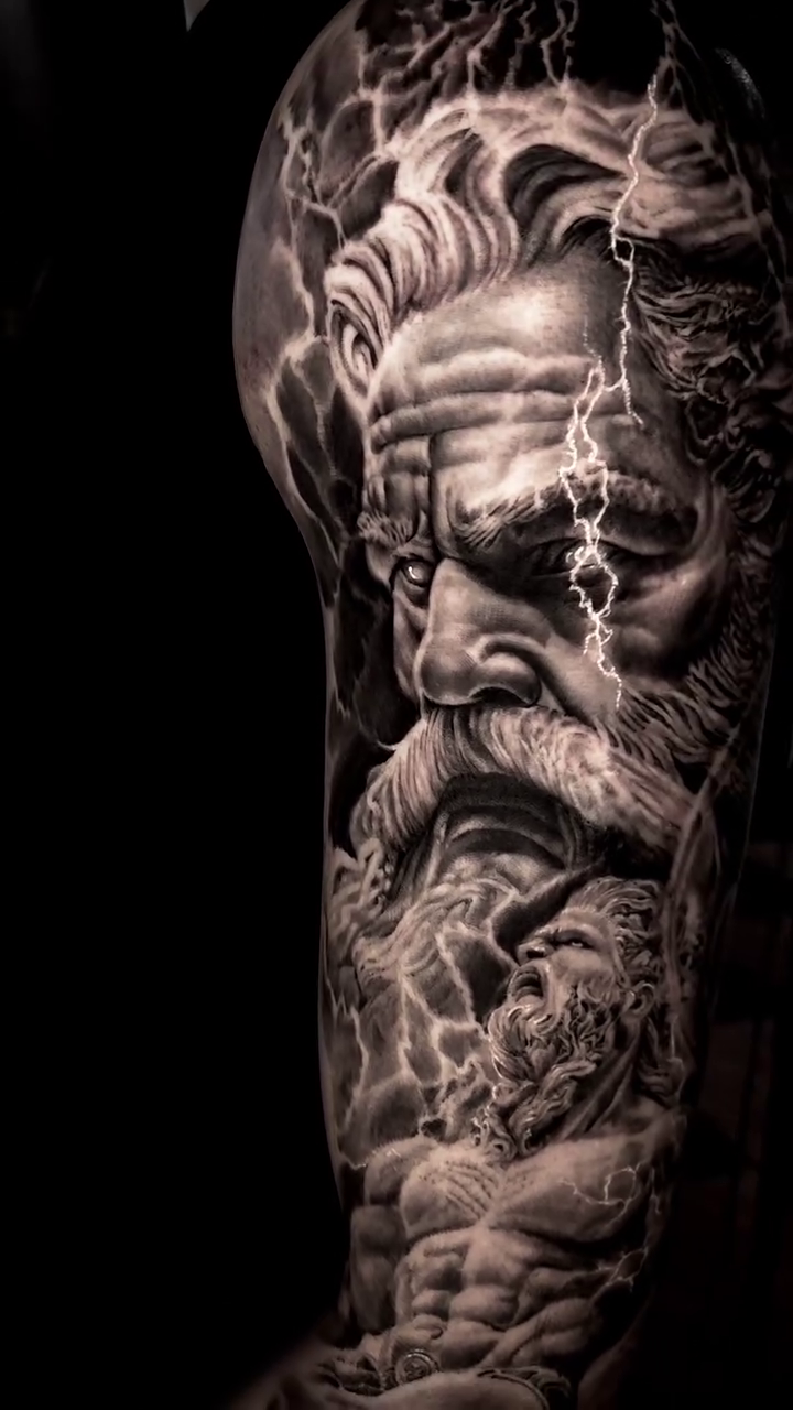 Zeus with atomic symbols realism tattoo by Pitasso tattoo black and grey