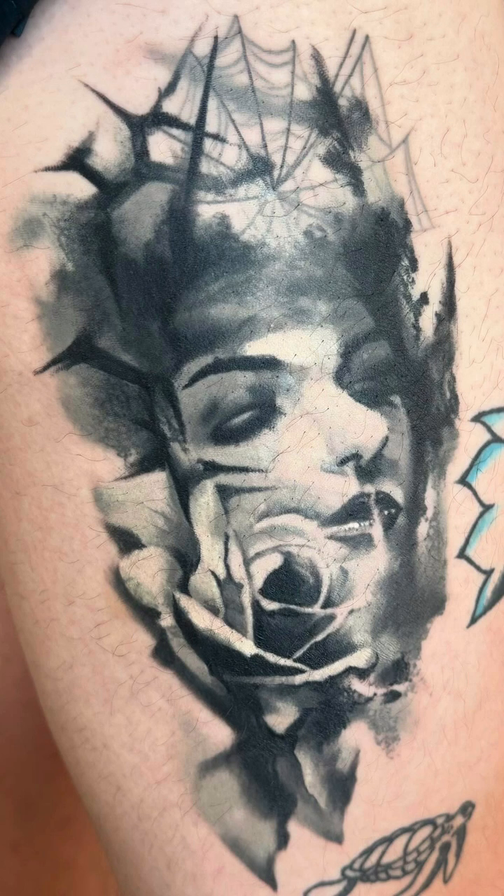 Woman and rose dark realism tattoo by Travis Thorpe