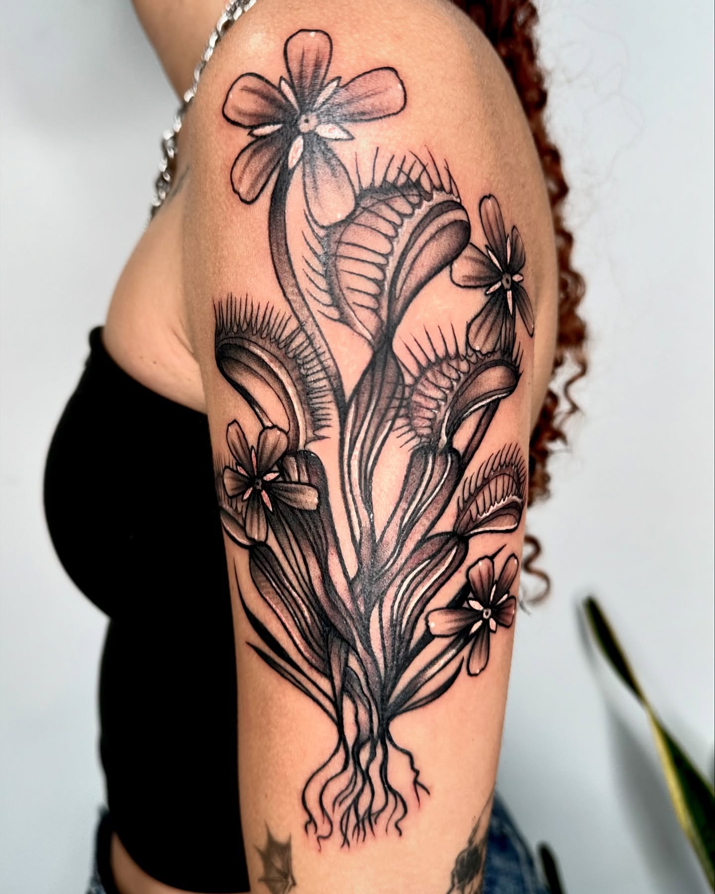 Floral bouquet black and grey tattoo on the upper arm by ✮ Monarch Tattoos ✮