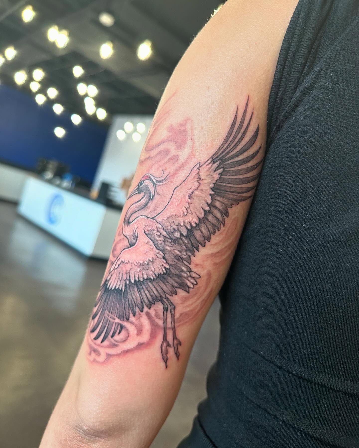 Flying crane realism tattoo on the forearm by Cameron Hobbs, Woodbridge, Virginia