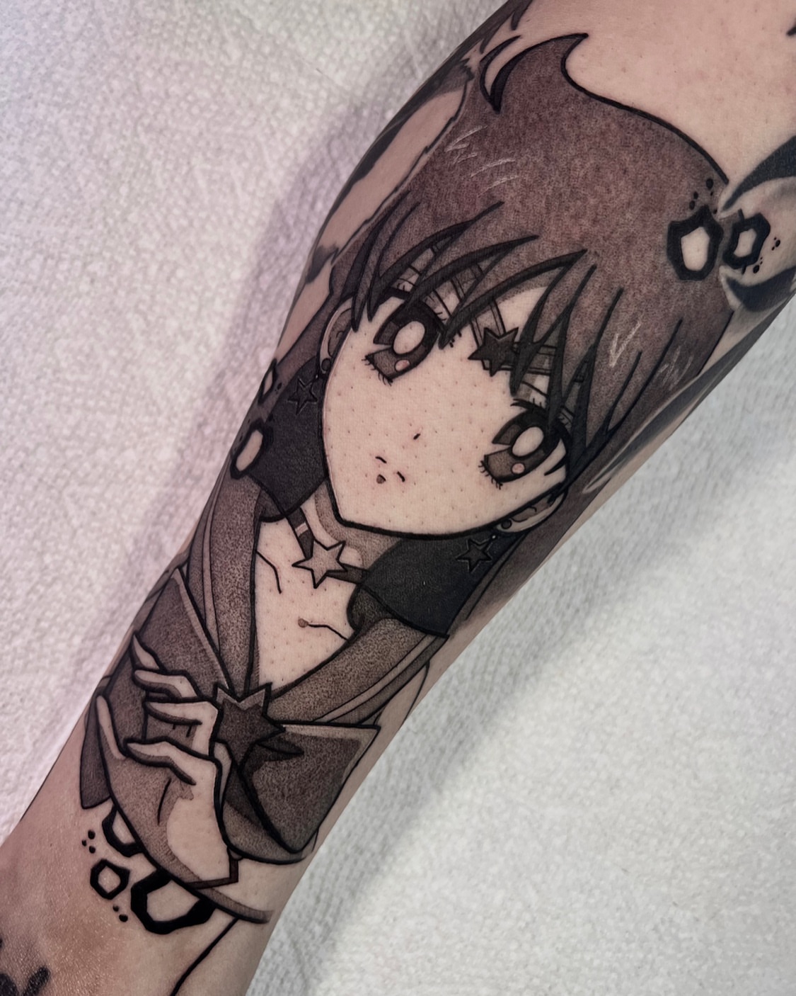 Anime character anime tattoo on the forearm by Chandler Roe